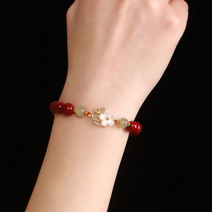 Bracelet de bénédiction en pierre de cinabre naturelle et jade Tridacna avec Buddha Stones