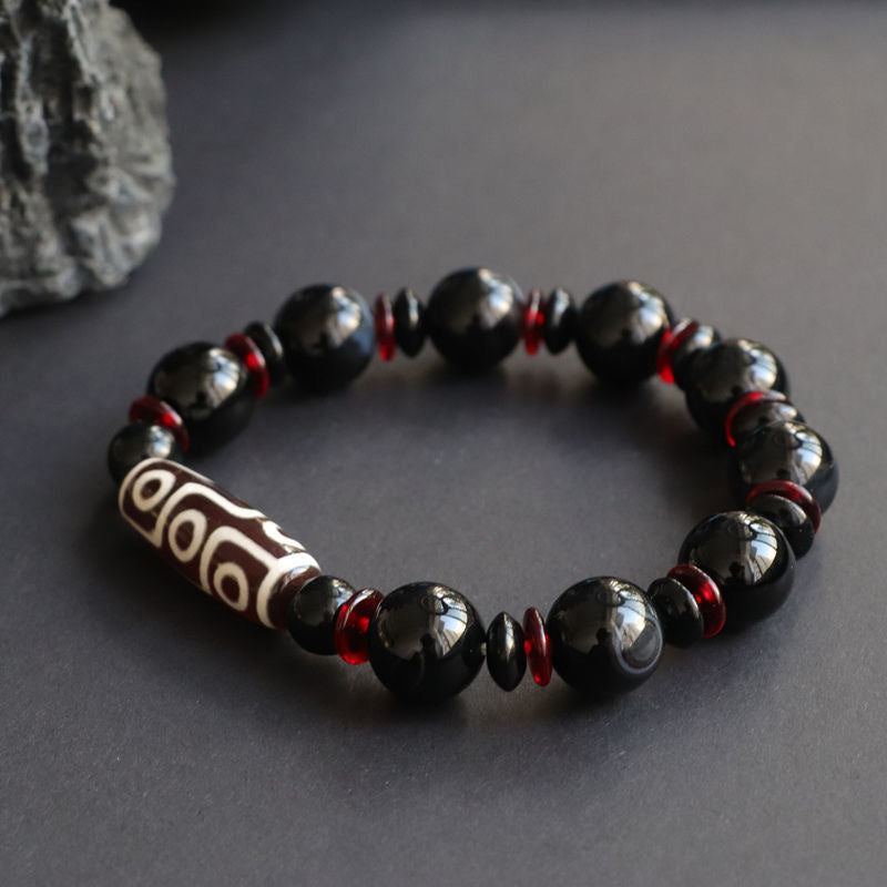 Bracelet de protection de richesse en perles dzi à neuf yeux en onyx noir de Buddha Stones