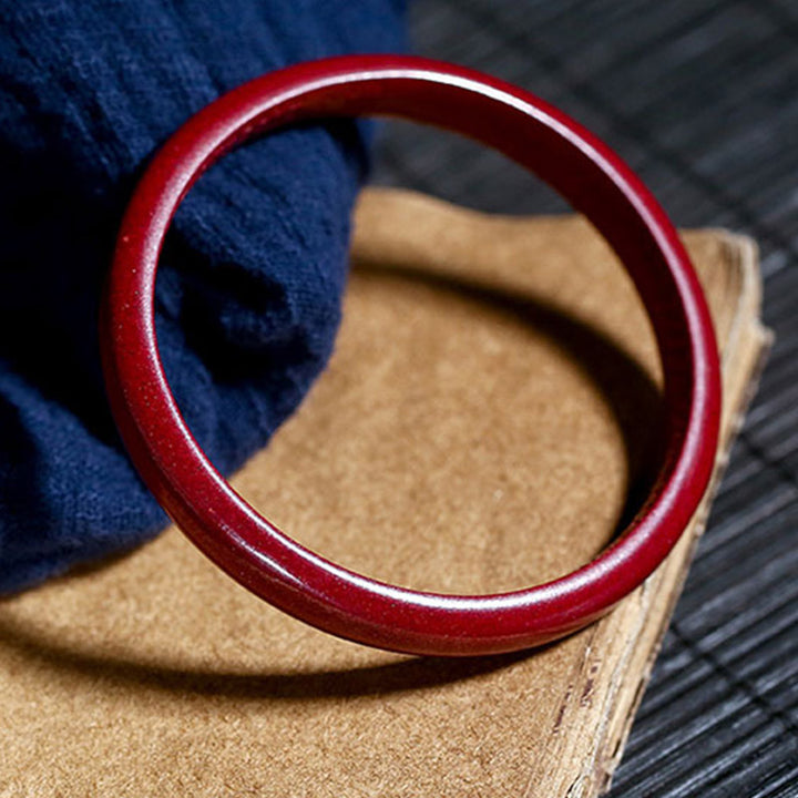 Bracelet jonc de bénédiction gravé du Sutra du cœur en Buddha Stones en cinabre - image 1