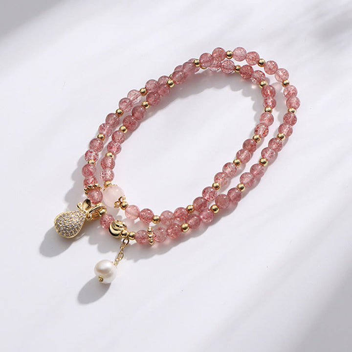 Bracelet double tour avec breloque positive et Buddha Stones en quartz fraise