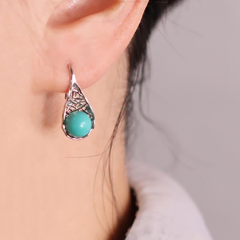 Boucles d'oreilles pendantes en argent sterling 925 avec Buddha Stones - Argent sterling 925 et turquoise - image 0