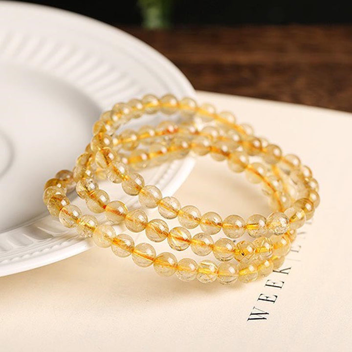 Bracelet de protection et de prospérité en Buddha Stones en citrine naturelle