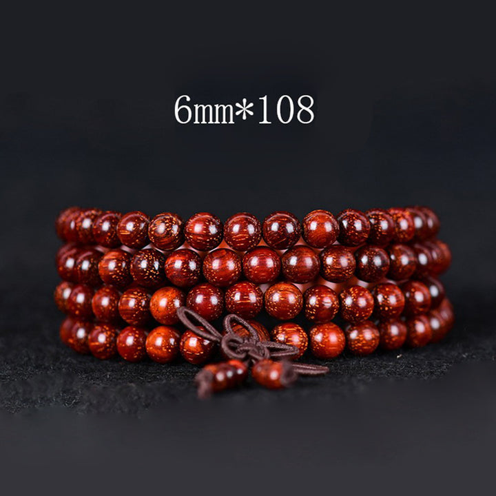 Bracelet d'équilibre tibétain en petites feuilles de santal rouge avec Buddha Stones