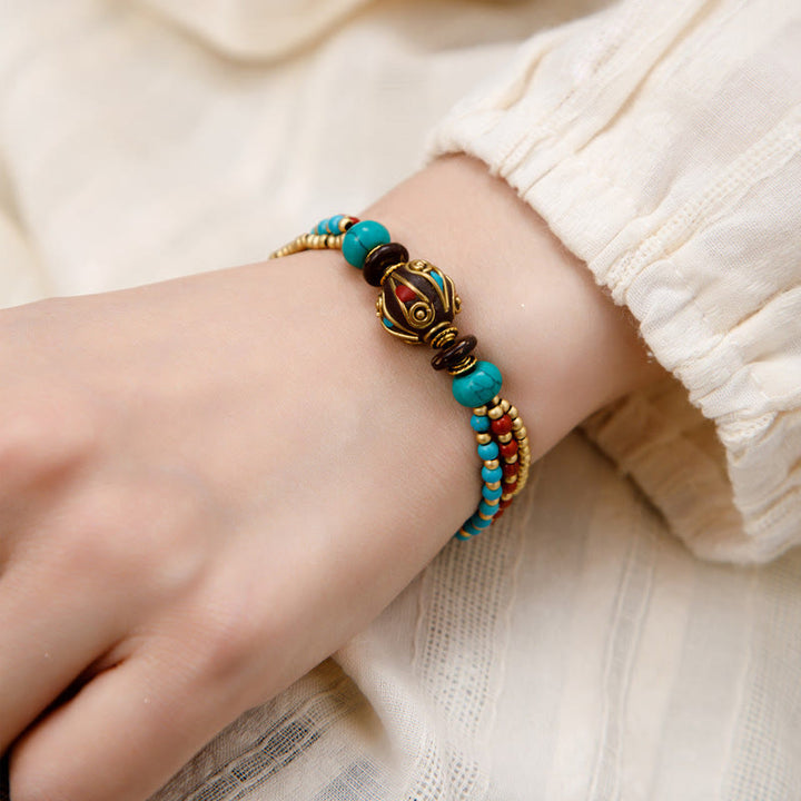 Bracelet de force de protection Om Mani Padme Hum en Buddha Stones tibétaines turquoise