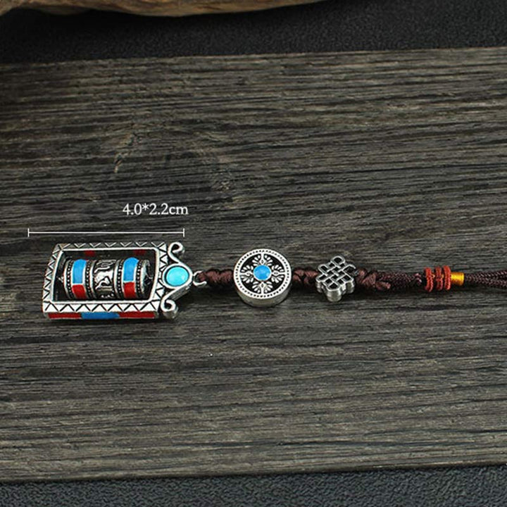 Porte-clés décoratif avec nœud rotatif et bénédiction en forme de roue de prière en six mots vrais en Buddha Stones