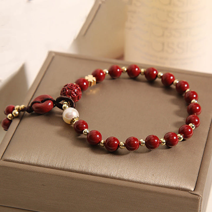 Bracelet de bénédiction avec breloque en cuivre et boucle de paix en cinabre naturel Buddha Stones