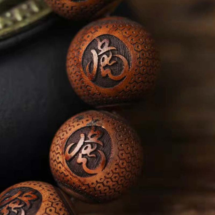 Bracelet de protection du tigre gravé en bois de rose tibétain Buddha Stones