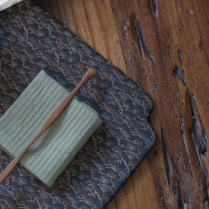 Dessous de verre élégant à motif de brocart floral pour tasse à thé