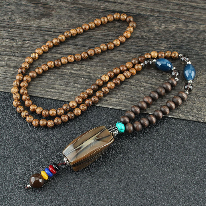 Collier pendentif en Buddha Stones tibétain en bois de wengé Bodhi Seed Agate Balance Peace