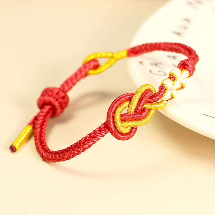 Bracelet de connexion porte-bonheur en forme de nœud de paix à huit fils fabriqué à la main par Buddha Stones