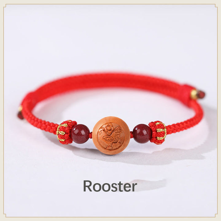Bracelet de richesse en bois de pêche naturel Buddha Stones et caractère Fu du zodiaque chinois sculpté en cinabre