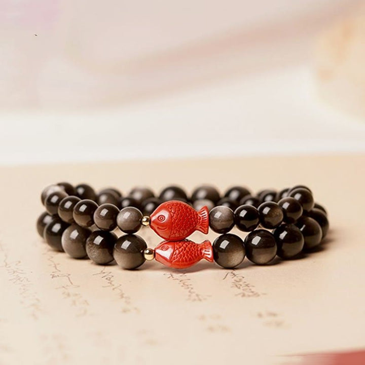 Bracelet de protection apaisante en obsidienne et cinabre avec Buddha Stones et reflets argentés naturels