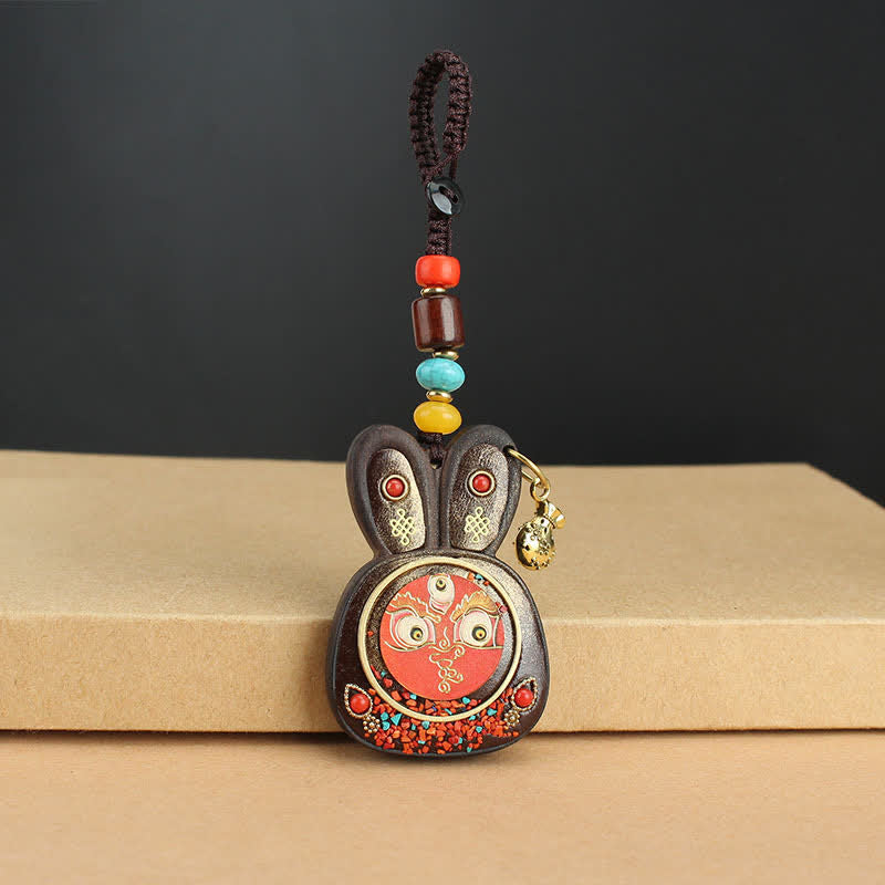 Porte-clés Thangka en ébène du Tibet représentant les cinq dieux de la richesse