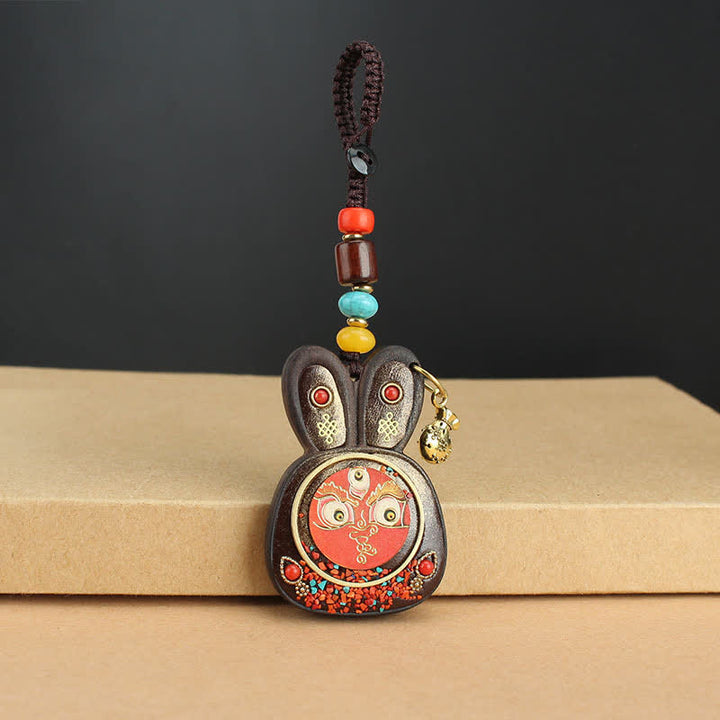 Porte-clés Thangka en ébène du Tibet représentant les cinq dieux de la richesse