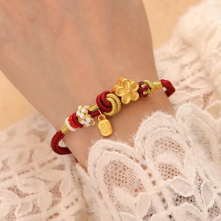 Bracelet porte-bonheur en fil rouge avec Buddha Stones et fleur de pêcher