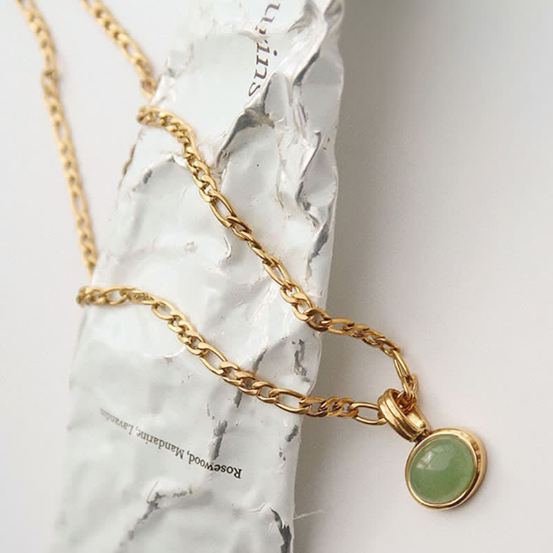 Collier pendentif ovale en acier titane et turquoise