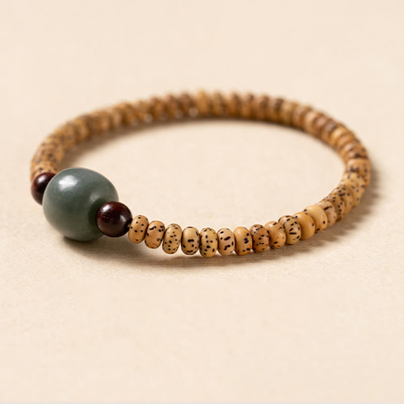 Bracelet de sagesse en bois de santal rouge à petites feuilles et Buddha Stones