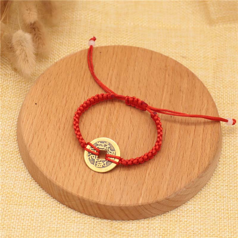 Bracelet tissé en fil rouge avec pièces de cuivre et Buddha Stones