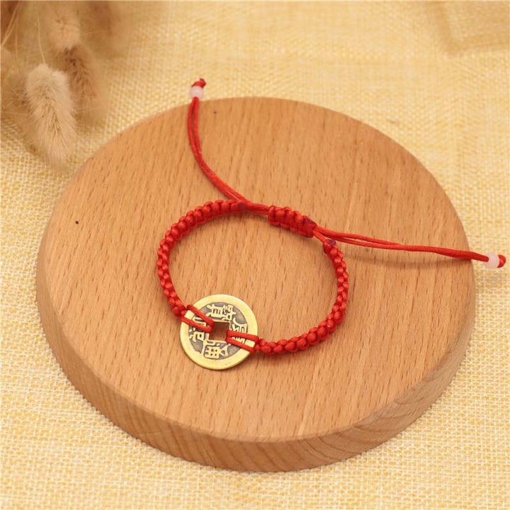 Bracelet tissé en fil rouge avec pièces de cuivre et Buddha Stones