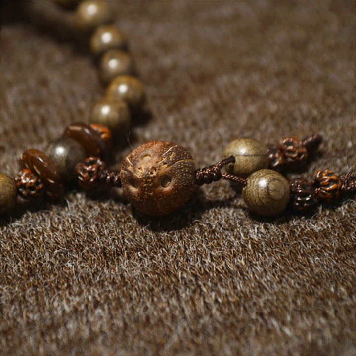 Bracelet Mala avec breloque de protection en bois de santal tibétain et Buddha Stones