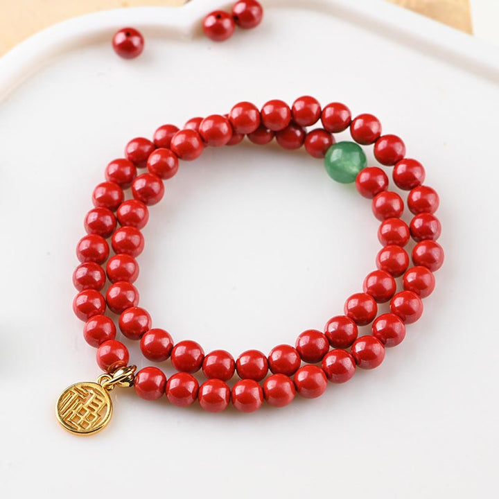 Collier porte-bonheur tibétain en aventurine verte et cinabre avec Buddha Stones