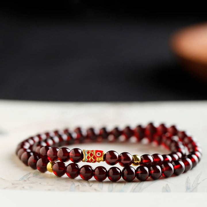 Bracelet de protection en grenat naturel avec poisson koï en or 999 de Buddha Stones - image 16