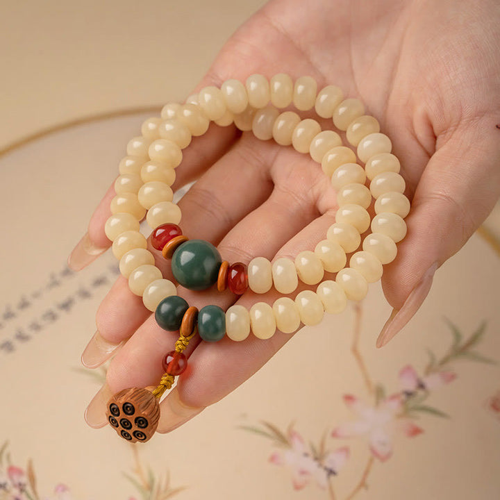 Bracelet double tour avec breloque en forme de gousse de lotus et graines de Bodhi et Buddha Stones