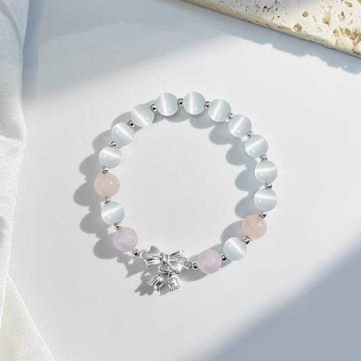 Bracelet à breloques en forme de rosette avec œil de chat, lavande et améthyste de Buddha Stones