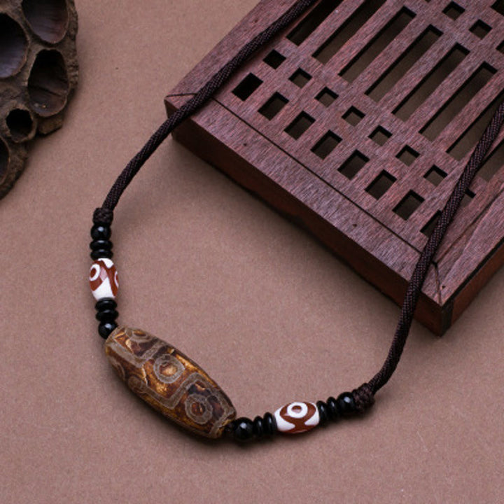 Collier de protection en perles tibétaines à neuf yeux Dzi Buddha Stones