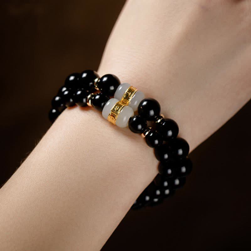 Bracelet magnétique pour couple en obsidienne Buddha Stones et jade Om Mani Padme Hum