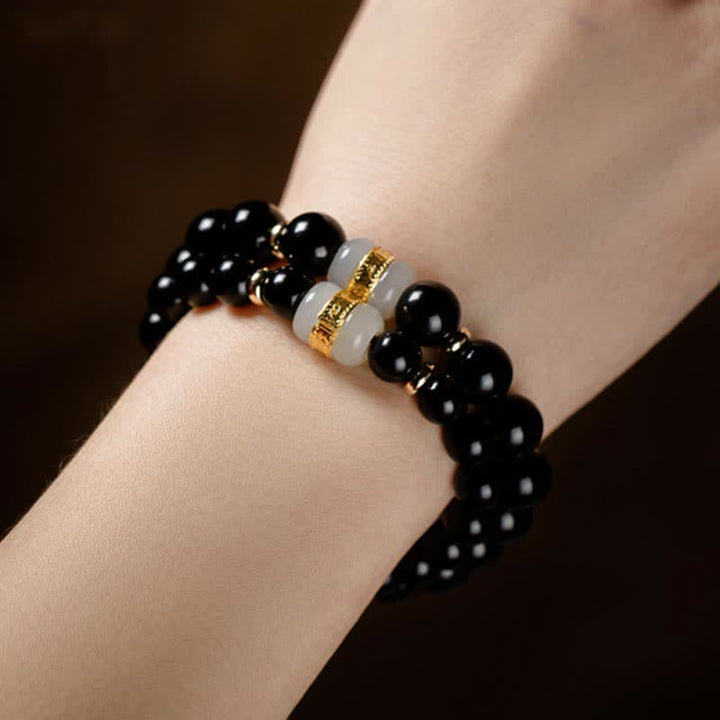 Bracelet magnétique pour couple en obsidienne Buddha Stones et jade Om Mani Padme Hum