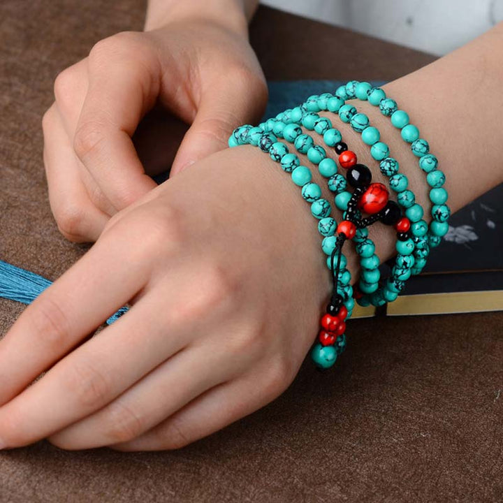 Bracelet de protection en perles de turquoise rouge et onyx noir Buddha Stones