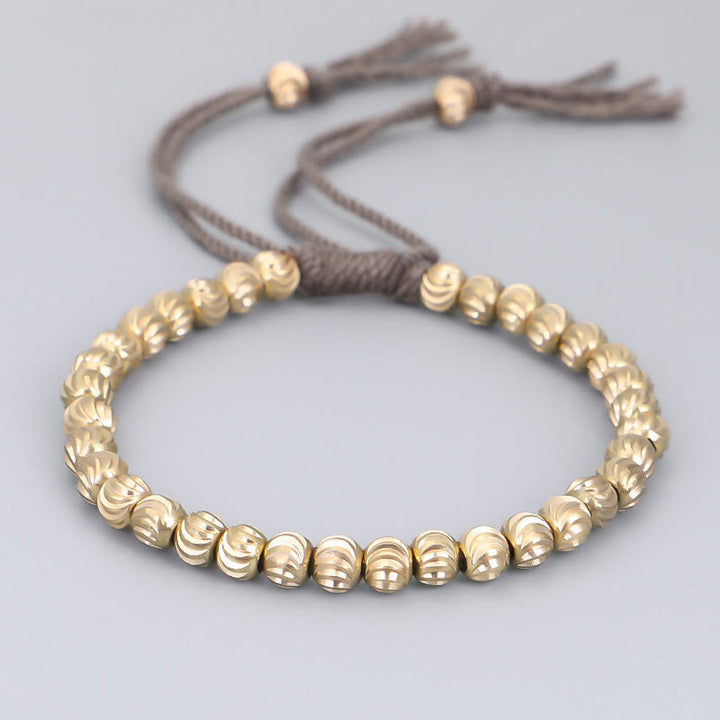 Bracelet porte-bonheur en perles de cuivre tibétaines faites à la main avec Buddha Stones