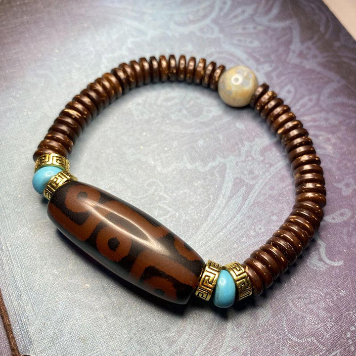 Bracelet de richesse en perles tibétaines à neuf yeux Dzi Buddha Stones
