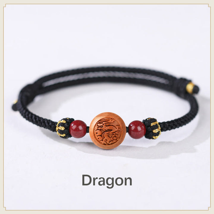 Bracelet de richesse en bois de pêche naturel Buddha Stones et caractère Fu du zodiaque chinois sculpté en cinabre