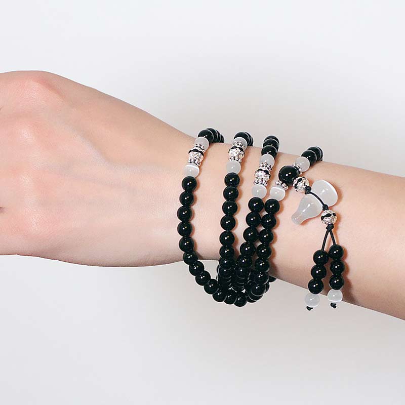Bracelet de méditation en perles de cristal blanc et onyx noir Buddha Stones