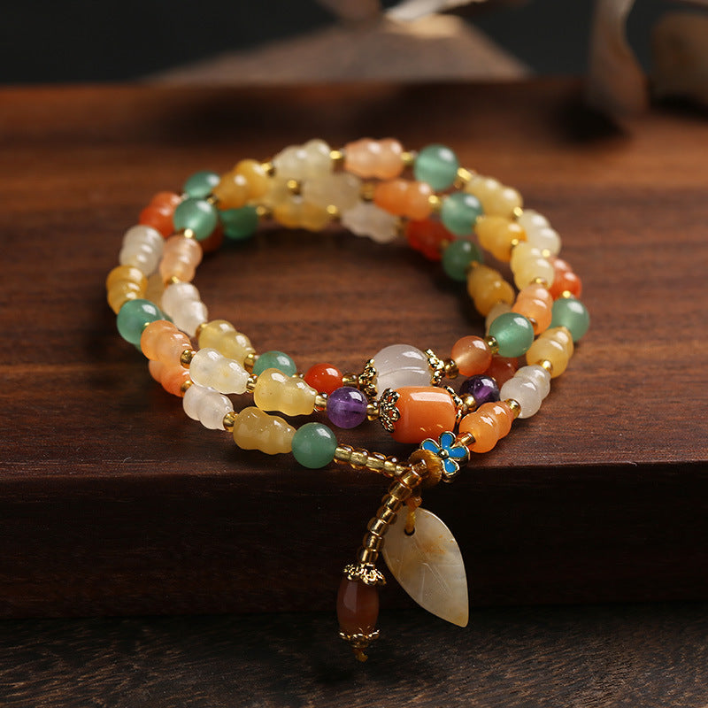 Bracelet de richesse en jade et soie dorée avec Buddha Stones