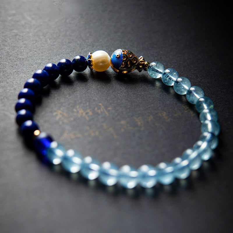 Bracelet de guérison en Buddha Stones, aigue-marine naturelle, lapis-lazuli et poisson - image 1