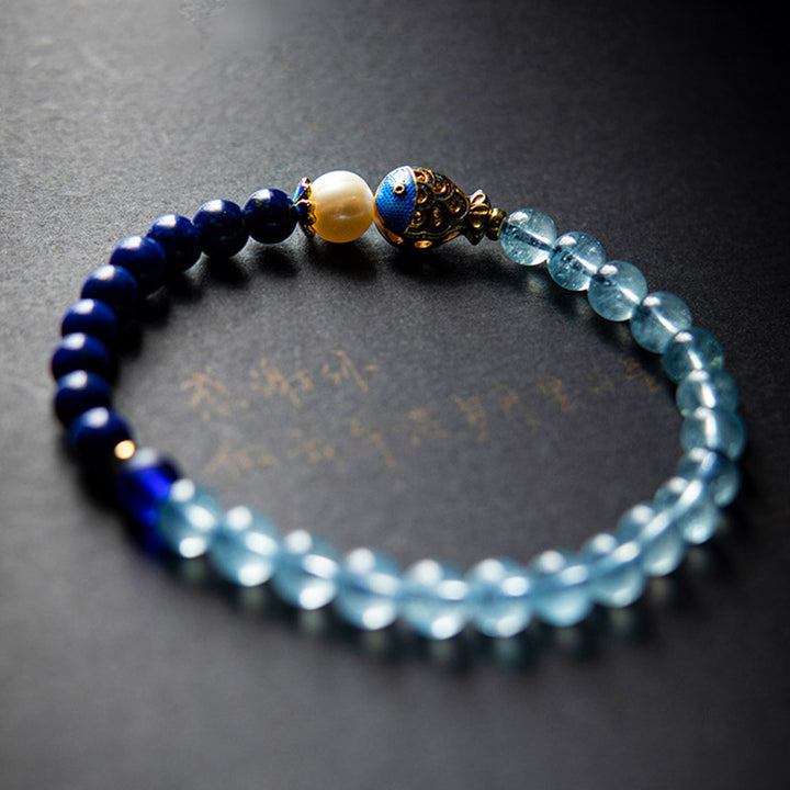 Bracelet de guérison en Buddha Stones, aigue-marine naturelle, lapis-lazuli et poisson - image 1