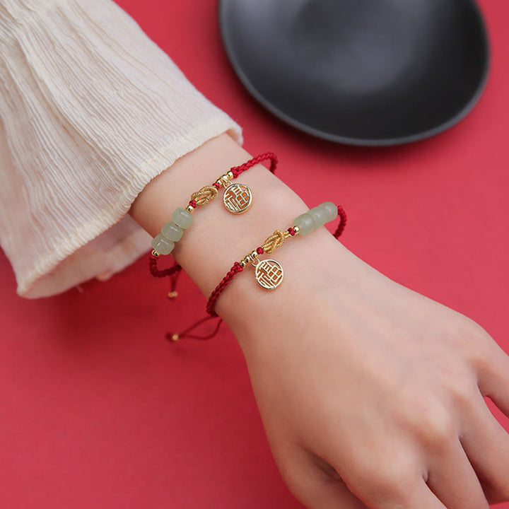 Bracelet porte-bonheur en corde rouge avec perles de jade fabriquées à la main par Buddha Stones