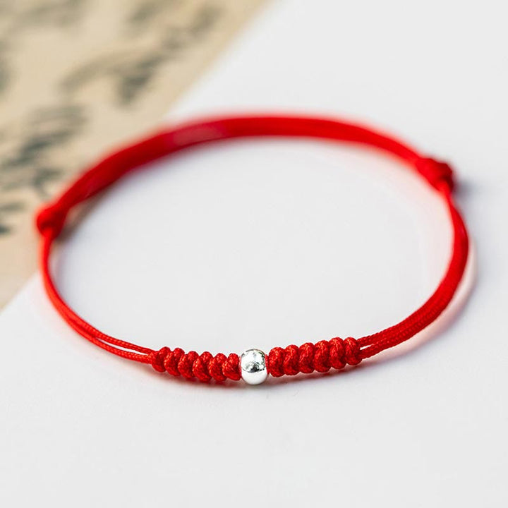 Bracelet en argent sterling 925 avec perle porte-bonheur et cordon fin tressé rouge, orné de Buddha Stones. - Perle ronde - Rouge (Tour de poignet 14-18 cm) - image 16