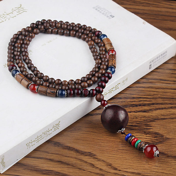 Collier pendentif en Buddha Stones tibétain en bois de wengé Bodhi Seed Agate Balance Peace