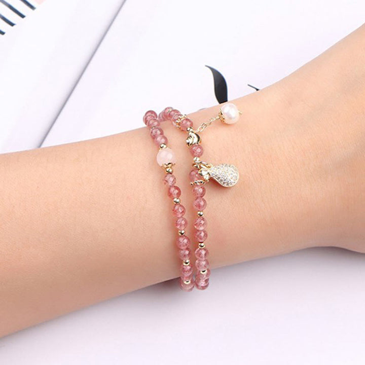 Bracelet double tour avec breloque positive et Buddha Stones en quartz fraise