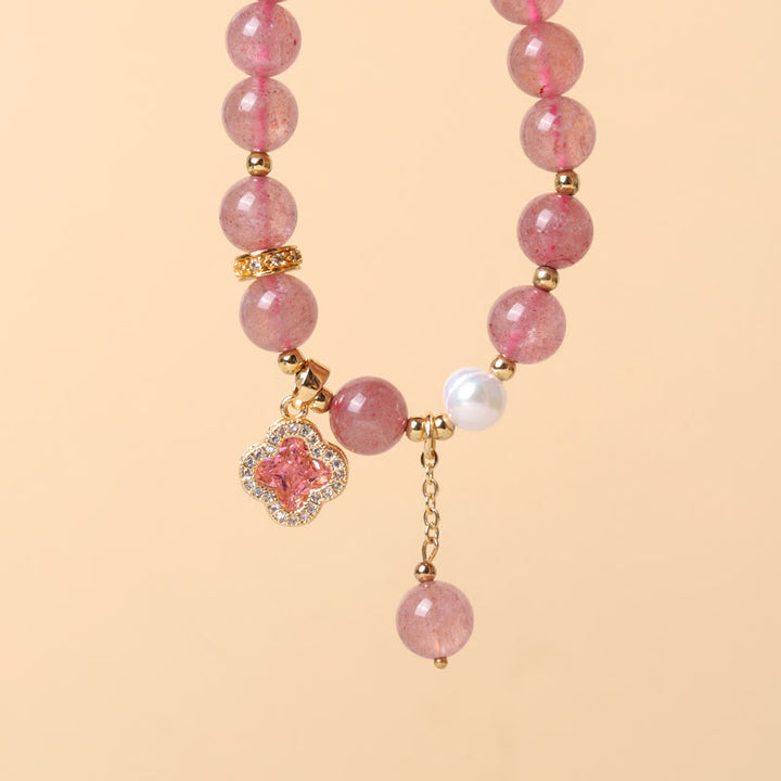 Bracelet de guérison à breloques en trèfle à quatre feuilles avec perles de quartz fraise et Buddha Stones