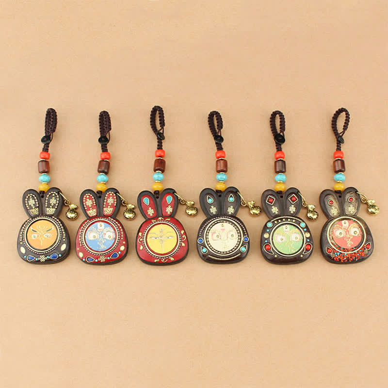 Porte-clés Thangka en ébène du Tibet représentant les cinq dieux de la richesse