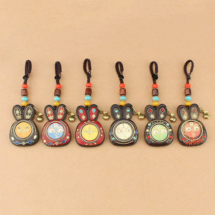 Porte-clés Thangka en ébène du Tibet représentant les cinq dieux de la richesse