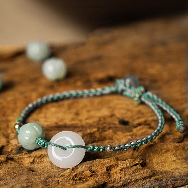 Bracelet tressé en jade blanc avec boucle de paix et perles citrouilles et Buddha Stones