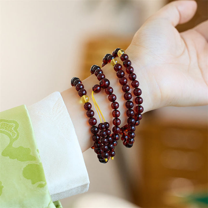 Bracelet Mala en Buddha Stones avec 108 perles d'ambre transparentes contre l'anxiété