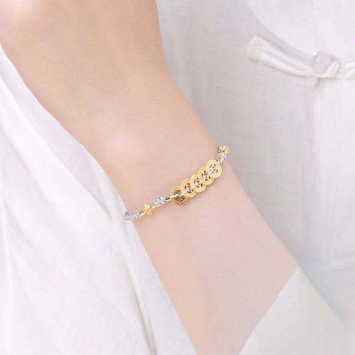 Bracelet tressé en corde bleue avec perles et arbre de fortune en cuivre et Buddha Stones