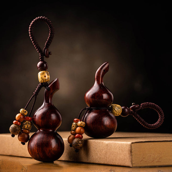 Porte-clés porte-bonheur en ébène tibétain à petites feuilles de gourde en bois de santal rouge